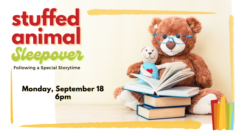 two stuffed animals read a book